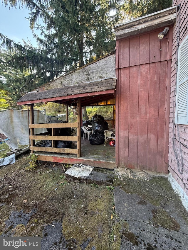 view of outbuilding with a carport