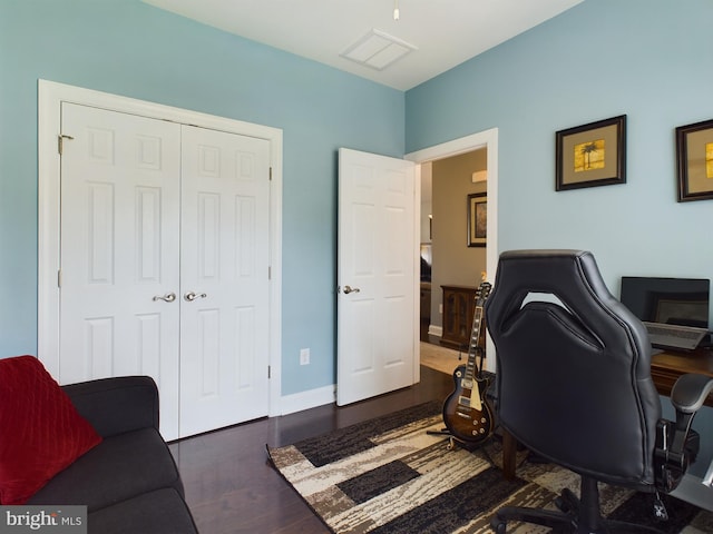 office with dark hardwood / wood-style floors