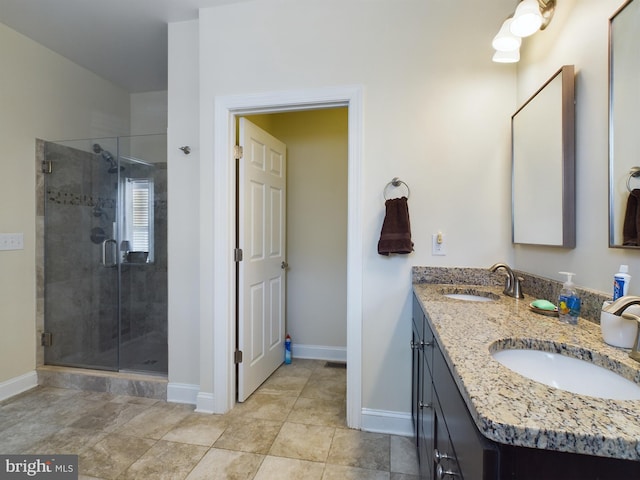 bathroom featuring vanity and a shower with shower door