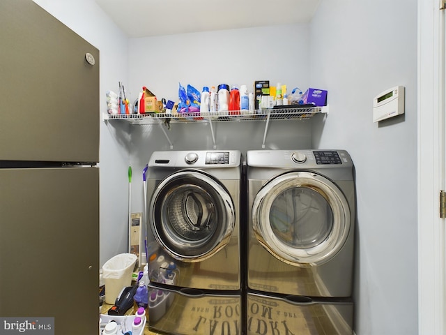 washroom featuring washer and dryer