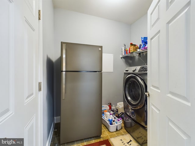 laundry area with washer / dryer