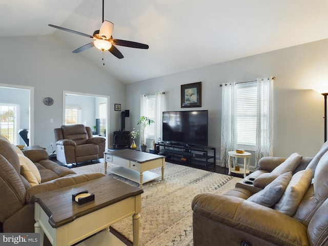 living room with high vaulted ceiling, wood-type flooring, and ceiling fan