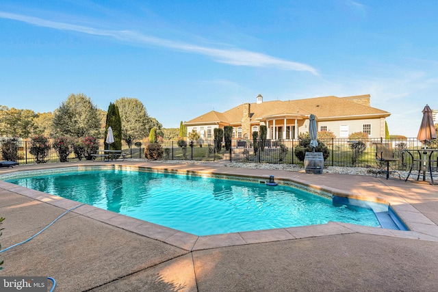 view of swimming pool featuring a patio