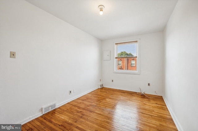 spare room with light hardwood / wood-style flooring