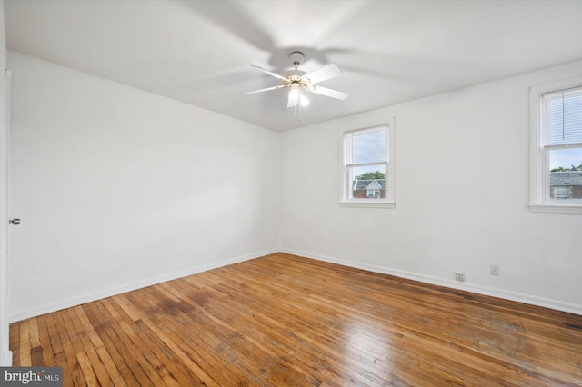 spare room featuring ceiling fan and hardwood / wood-style flooring