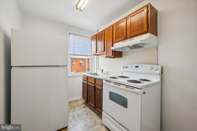 kitchen with sink and white appliances