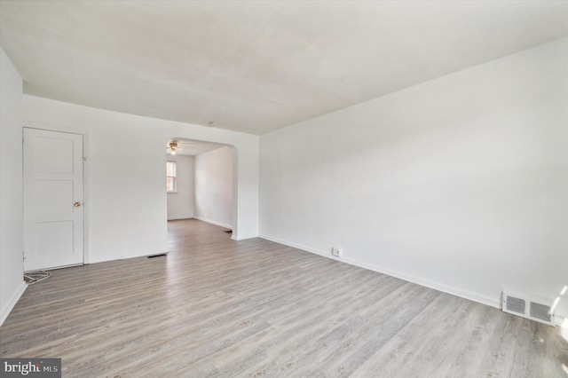 spare room with light hardwood / wood-style flooring