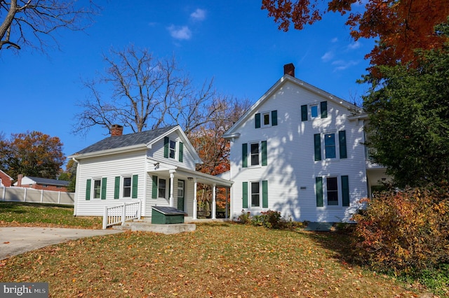 438 Green Spring Rd, York, PA 17403 - view of front of home with fence, a chimney, and a front yard