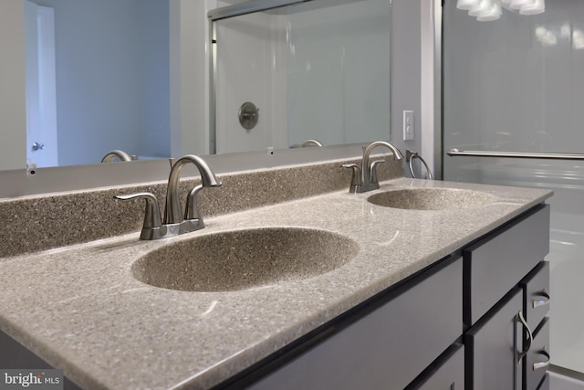 bathroom with vanity and an enclosed shower