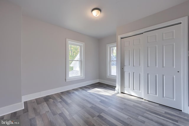 438 Green Spring Rd, York, PA 17403 - unfurnished bedroom with baseboards, a closet, and wood finished floors