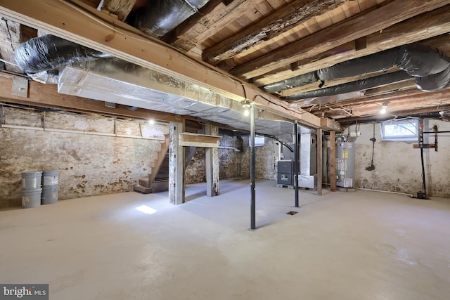 438 Green Spring Rd, York, PA 17403 - below grade area with heating unit, stairway, and gas water heater