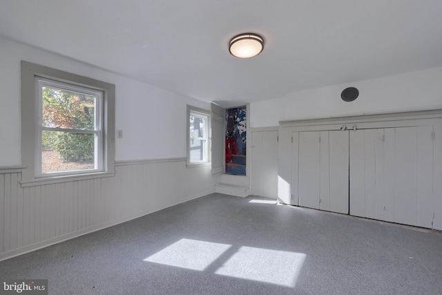 438 Green Spring Rd, York, PA 17403 - unfurnished bedroom with a wainscoted wall and multiple windows