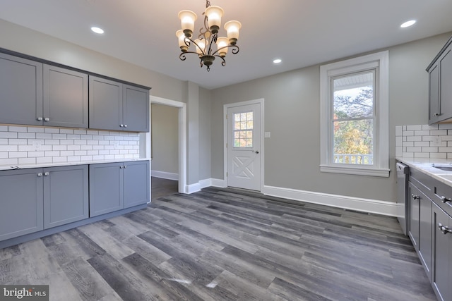 438 Green Spring Rd, York, PA 17403 - kitchen featuring a chandelier, backsplash, light countertops, dark wood-style floors, and gray cabinetry