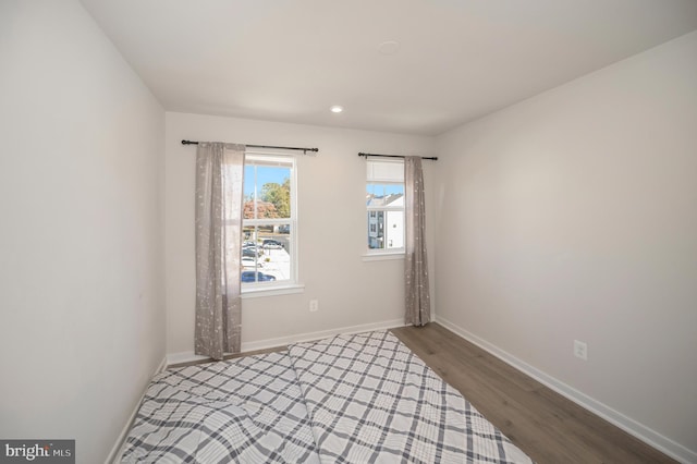 unfurnished room featuring hardwood / wood-style floors