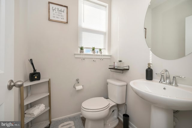 bathroom with sink and toilet