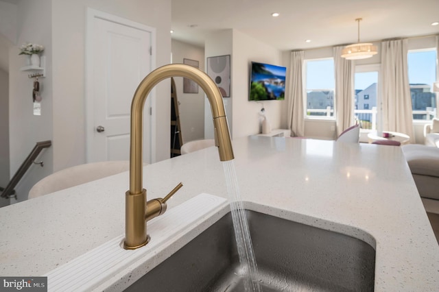 details featuring sink and decorative light fixtures