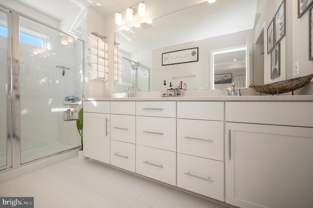 bathroom featuring vanity and an enclosed shower