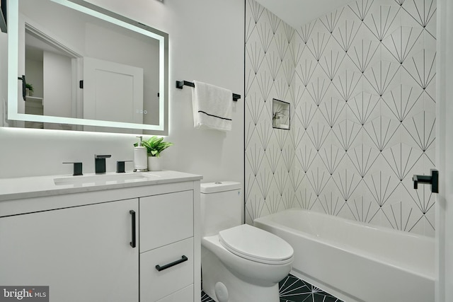 full bathroom with vanity, tile patterned floors, toilet, and shower / bath combination