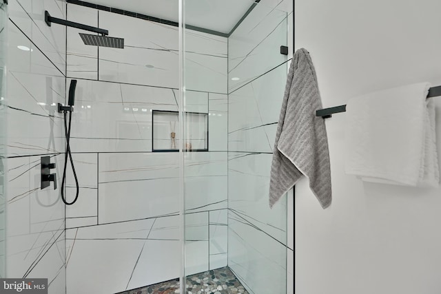 bathroom with a shower with shower door