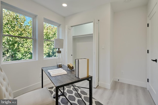 office area with light hardwood / wood-style flooring