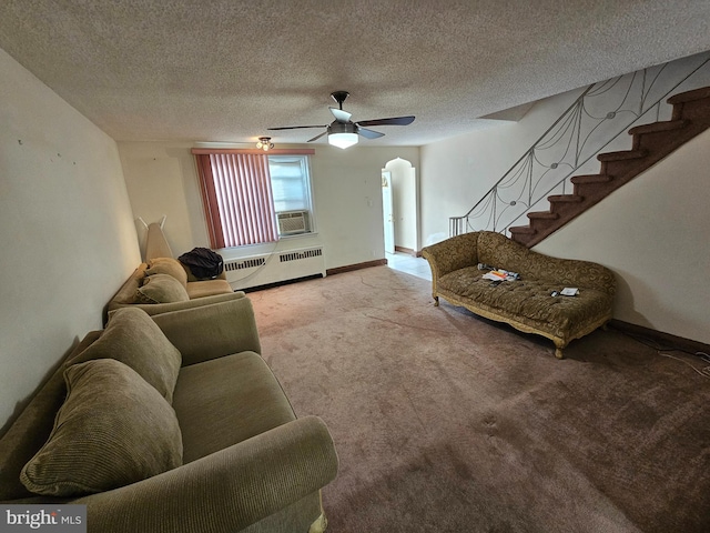 living room featuring radiator, light carpet, a textured ceiling, and cooling unit