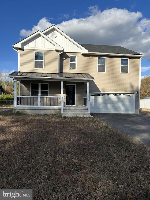 view of front of property with a garage and a porch