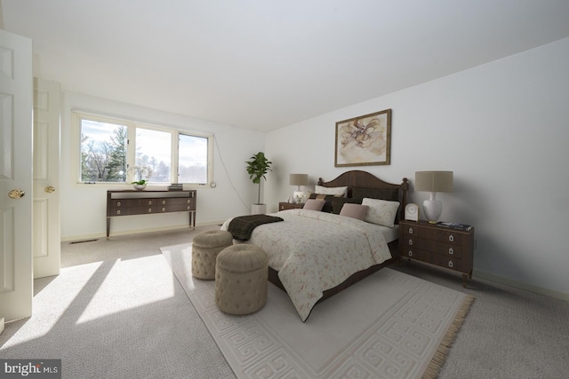 bedroom featuring light colored carpet