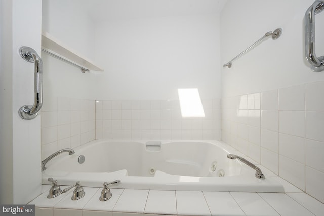 bathroom featuring tiled bath