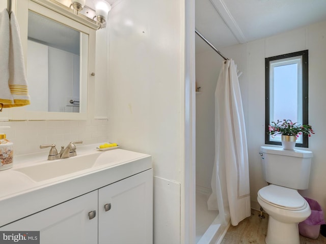 bathroom with toilet, hardwood / wood-style floors, tasteful backsplash, vanity, and a shower with shower curtain