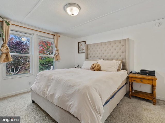 bedroom with light colored carpet