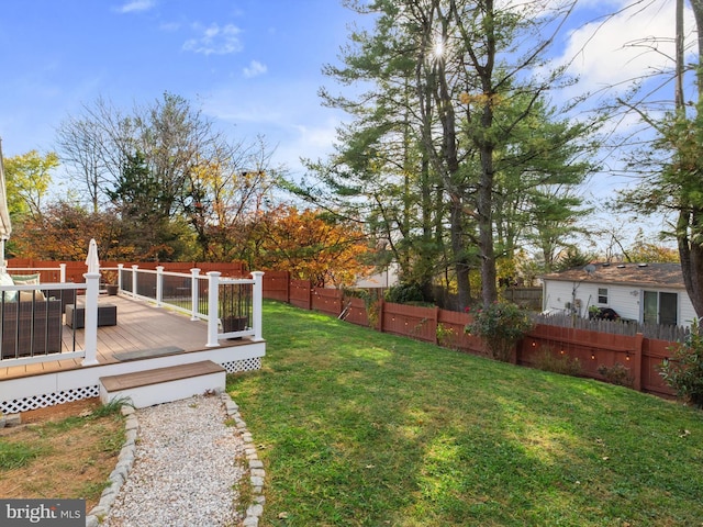 view of yard featuring a wooden deck