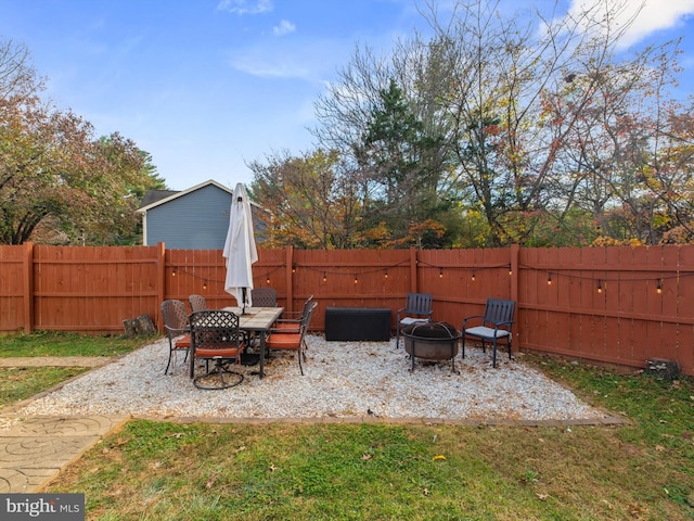 view of patio with an outdoor fire pit