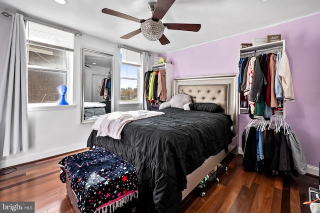 bedroom featuring dark wood-type flooring and ceiling fan