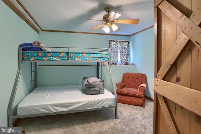 bedroom featuring carpet, crown molding, and ceiling fan