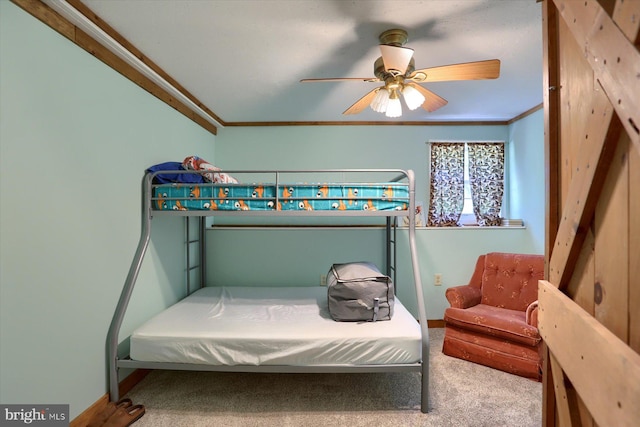 carpeted bedroom with crown molding and ceiling fan