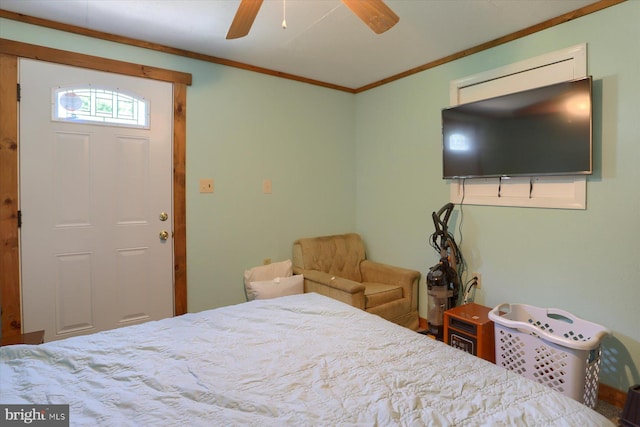 bedroom with ornamental molding and ceiling fan