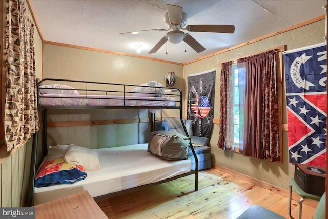 bedroom featuring wood-type flooring and ceiling fan