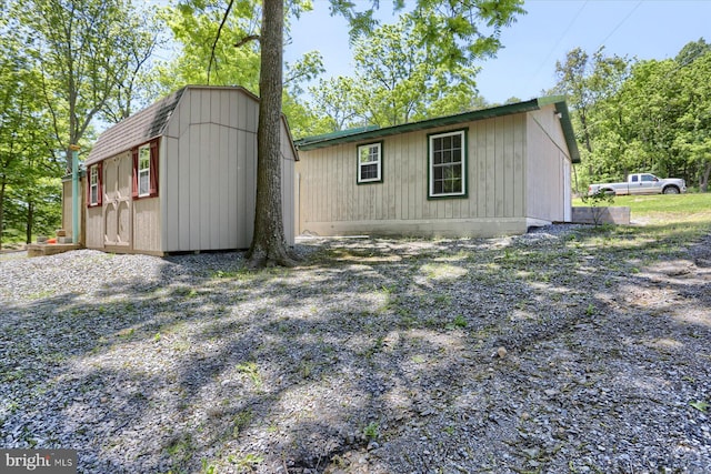 exterior space with a shed