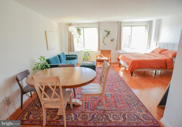 dining area with wood finished floors
