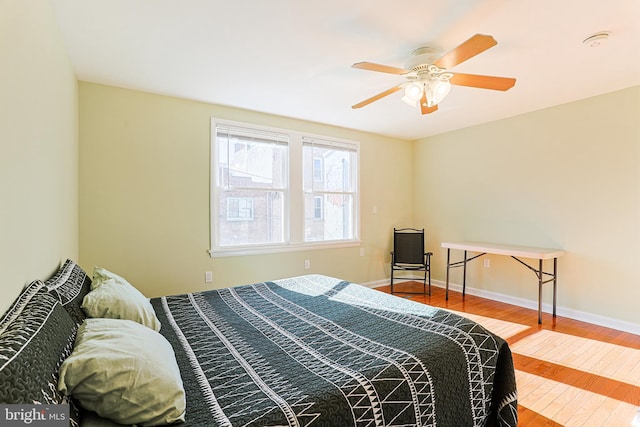 bedroom featuring ceiling fan and hardwood / wood-style floors