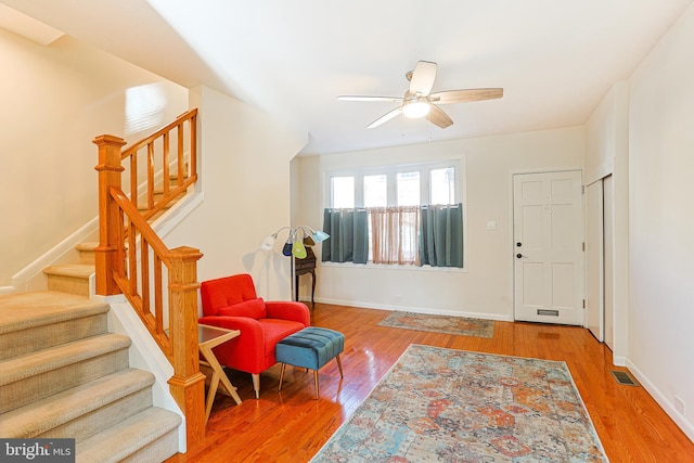 entryway with ceiling fan and hardwood / wood-style floors