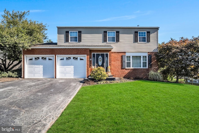 front of property with a garage and a front lawn