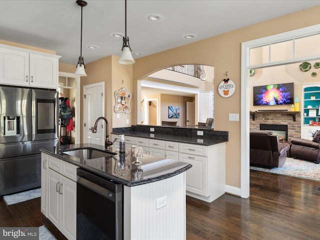 kitchen featuring black dishwasher, sink, stainless steel fridge with ice dispenser, white cabinetry, and dark hardwood / wood-style flooring