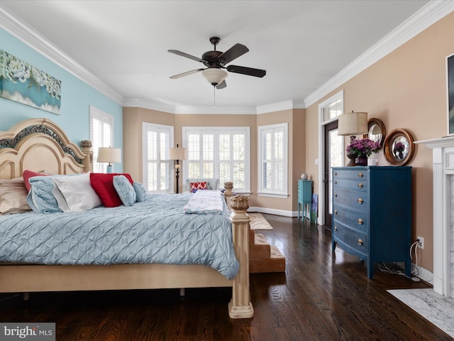 bedroom with crown molding, dark hardwood / wood-style floors, and ceiling fan