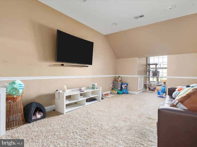 playroom featuring carpet and vaulted ceiling