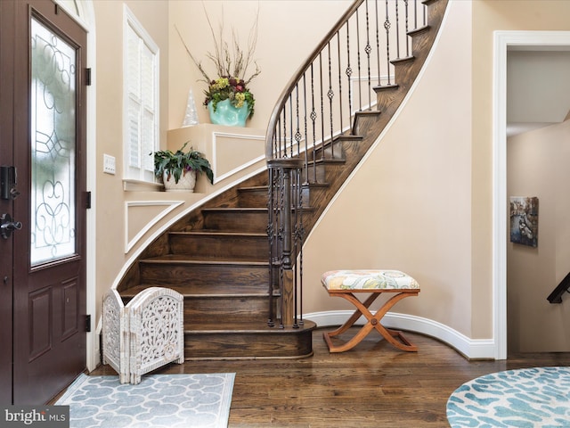 foyer entrance with hardwood / wood-style flooring