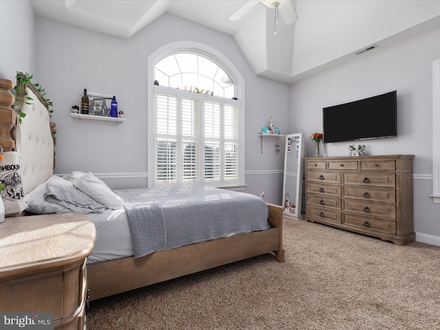 bedroom with carpet floors, vaulted ceiling, and ceiling fan