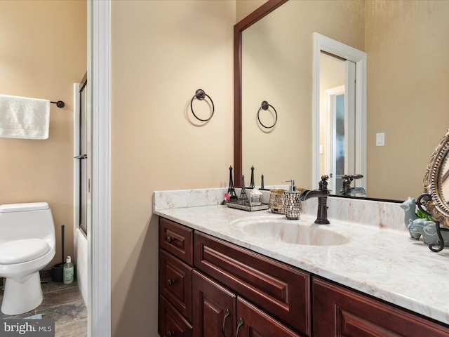 bathroom with vanity and toilet