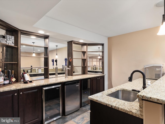 bar featuring sink, stainless steel fridge, light stone counters, and beverage cooler