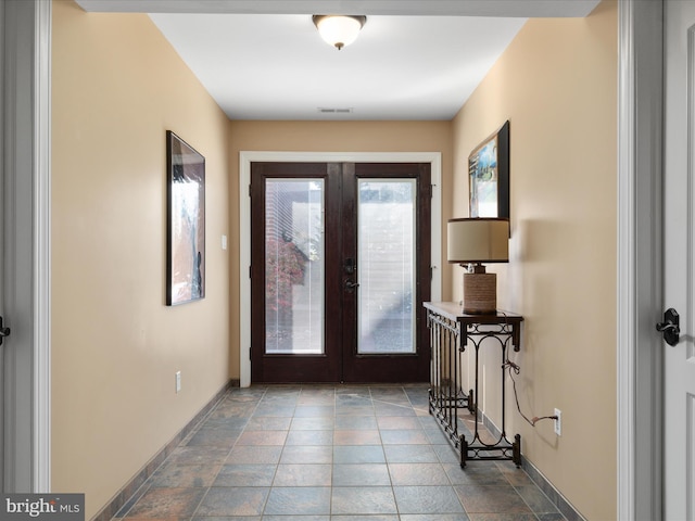 entryway featuring french doors